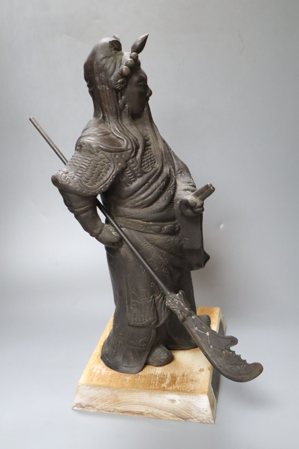 A Chinese bronze figure of Guandi, 42cm